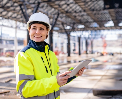 Construction worker using tablet on site